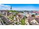 Beautiful aerial view of the neighborhood showcasing the well-maintained townhomes and a clear blue sky at 5444 Zephyr St # 203, Arvada, CO 80002