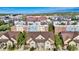 Community aerial view showcasing the layout of the townhomes in relation to surrounding buildings and amenities at 5444 Zephyr St # 203, Arvada, CO 80002
