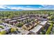 Wide aerial shot of the neighborhood showcasing the community layout, with buildings, streets, and greenery at 5444 Zephyr St # 203, Arvada, CO 80002