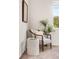 Cozy bedroom corner featuring a comfortable chair, side table, and natural light at 5444 Zephyr St # 203, Arvada, CO 80002