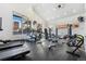 Well-lit fitness center with modern exercise equipment and large windows at 5444 Zephyr St # 203, Arvada, CO 80002