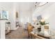 Spacious living room with a fireplace, modern decor, and plenty of natural light at 5444 Zephyr St # 203, Arvada, CO 80002