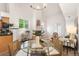 Open floorplan with dining area, living space, and modern decor in neutral tones at 5444 Zephyr St # 203, Arvada, CO 80002
