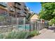Community pool and lounge area next to the building complex, perfect for relaxation and socializing at 5444 Zephyr St # 203, Arvada, CO 80002
