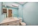 Modern bathroom featuring a white vanity, large mirror, and sleek fixtures at 7834 S Windermere Cir, Littleton, CO 80120