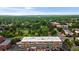 A high-angle aerial shot of an apartment building surrounded by mature trees and manicured greenery at 2500 S York St # 116, Denver, CO 80210