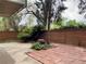 Backyard patio with a combination of concrete, brick, and tile surrounded by lush landscaping at 2500 S York St # 116, Denver, CO 80210