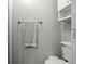 Cozy bathroom featuring a towel rack with a decorative towel and a shelf for storage at 2500 S York St # 116, Denver, CO 80210
