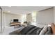 Bedroom with carpet, warm tones, lots of natural light, and modern furniture at 2500 S York St # 116, Denver, CO 80210