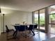 Dining room featuring a modern table and chairs, hardwood floors, and a sliding door to the outside at 2500 S York St # 116, Denver, CO 80210