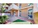 Brick building featuring walkout balconies, and outdoor space with mature landscaping at 2500 S York St # 116, Denver, CO 80210