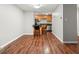 Efficient kitchen with stainless steel appliances, breakfast bar, and hardwood floors at 2500 S York St # 116, Denver, CO 80210