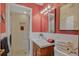 Updated bathroom with a walk-in shower and modern vanity at 2920 S York St, Denver, CO 80210