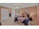 Bright bedroom with a large window, comfortable bedding, and stylish decor at 2920 S York St, Denver, CO 80210