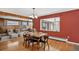 Bright dining room with hardwood floors adjacent to a cozy living area at 2920 S York St, Denver, CO 80210