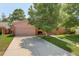 Charming single-story home with a well-manicured front yard and a two-car garage at 2920 S York St, Denver, CO 80210