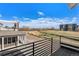 Enjoy scenic views from the private balcony, overlooking a peaceful street and a beautiful landscape at 888 S Valentia St # 101, Denver, CO 80247