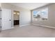 Bright bedroom with neutral walls, ensuite bath and a large window with natural light at 888 S Valentia St # 101, Denver, CO 80247