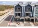 New construction townhomes feature modern exteriors with private balconies, landscaping, and convenient street access at 888 S Valentia St # 101, Denver, CO 80247