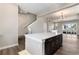 Spacious kitchen featuring a center island connecting to an open living room space at 888 S Valentia St # 101, Denver, CO 80247