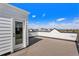 Relax on the rooftop deck with composite decking, providing an excellent spot for entertaining and enjoying expansive views at 888 S Valentia St # 101, Denver, CO 80247