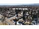 Aerial view of house and neighborhood, near a lake at 4830 W Vassar Ave, Denver, CO 80219