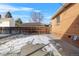 Large backyard with snow, partially fenced at 4830 W Vassar Ave, Denver, CO 80219