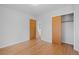 Bedroom with hardwood floors and closet at 4830 W Vassar Ave, Denver, CO 80219