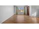 Hardwood floor living room with large window at 4830 W Vassar Ave, Denver, CO 80219