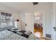 Bedroom featuring wood floors, bright natural light and view into adjoining room at 1335 S Sherman St, Denver, CO 80210