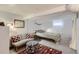Finished basement with a cozy bedroom area, complete with seating and soft lighting at 1335 S Sherman St, Denver, CO 80210