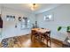 Cozy dining area featuring hardwood floors, natural light, and view of the front entrance at 1335 S Sherman St, Denver, CO 80210