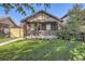 Charming brick home featuring a well-manicured lawn and inviting facade, perfect for curb appeal at 1335 S Sherman St, Denver, CO 80210