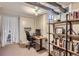 Finished basement features an office space with a desk and shelves, perfect for working from home at 1335 S Sherman St, Denver, CO 80210