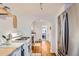 Bright kitchen area showing a stainless fridge, range and hardwood floors at 1335 S Sherman St, Denver, CO 80210