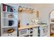 Efficient kitchen space with built-in microwave, open shelving, and a gas range at 1335 S Sherman St, Denver, CO 80210