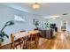 Open-concept living space with hardwood floors, view of the dining area and living room at 1335 S Sherman St, Denver, CO 80210