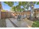 Charming backyard patio with privacy fence, mature trees, and ample space for outdoor gatherings at 1335 S Sherman St, Denver, CO 80210