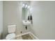 Small half bathroom with toilet and sink at 11250 Florence St # 29D, Commerce City, CO 80640