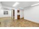 Finished basement offering natural light, storage shelving and tile flooring at 140 Lane Ct, Fort Lupton, CO 80621