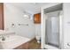 Bathroom featuring a standing shower, single sink vanity and tile flooring at 140 Lane Ct, Fort Lupton, CO 80621