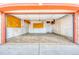 Attached two car garage featuring overhead lighting and shelving units at 140 Lane Ct, Fort Lupton, CO 80621
