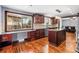 Gourmet kitchen featuring custom wood cabinets, granite countertops, and stainless steel appliances, perfect for culinary enthusiasts at 140 Lane Ct, Fort Lupton, CO 80621