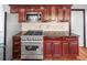Modern kitchen design with stainless steel appliances, custom cabinets, granite countertops, and tile backsplash, ready for your style at 140 Lane Ct, Fort Lupton, CO 80621