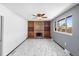 Comfortable living room features a brick fireplace and custom wooden built-ins at 140 Lane Ct, Fort Lupton, CO 80621