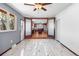 Bright open area with marble tiled floor connecting to the kitchen through glass doors at 140 Lane Ct, Fort Lupton, CO 80621