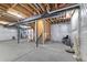 Unfinished basement with exposed beams and ductwork and walk up stairs at 4343 S Nepal Ct, Centennial, CO 80015