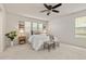Bright bedroom with neutral decor, carpet, ceiling fan, and a large window at 4343 S Nepal Ct, Centennial, CO 80015