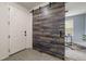 Close-up of the front entrance with a decorative barn door leading to an adjacent office space at 4343 S Nepal Ct, Centennial, CO 80015