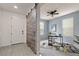 Bright entryway with tile flooring, a barn door, and a glimpse of an adjacent office space at 4343 S Nepal Ct, Centennial, CO 80015